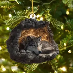 Christmas tree hanging ornament featuring a 2D flat acrylic wolf in a tree cave design.