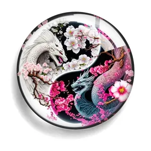 Detailed view of round yin yang dragon acrylic fridge magnet with cherry blossom art.