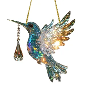 Acrylic hummingbird hanging ornament with crystal pendant and glowing light effects for decor.