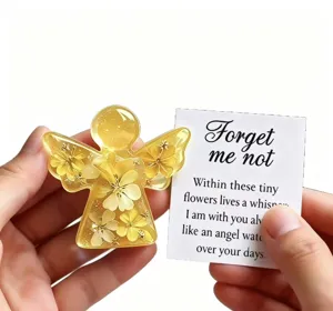 Handmade yellow resin angel keepsake figurine with embedded dried flowers and greeting card gift.