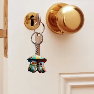 Green couple owl acrylic keychain pendant, cute hanging accessory for keys or car mirror.