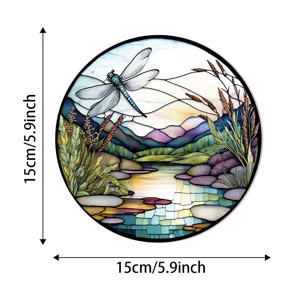 Detailed view of stained glass dragonfly suncatcher showcasing vibrant river landscape and colors.