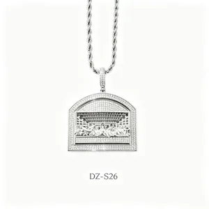 Detailed close-up shot of men hip hop iced out last supper pendant necklace sparkling.