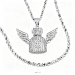 Detailed shot of iced out money bag pendant necklace with wings, cubic zirconia pavé.