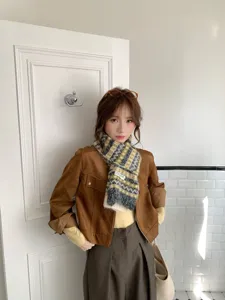 Cozy Fair Isle jacquard knitted scarf with stylish color blocking for winter outfits.