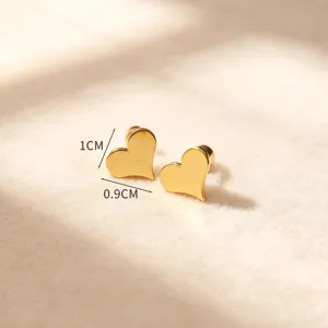 Boucles d'oreilles cœur en acier titane doré, design de bijoux de mode minimaliste.