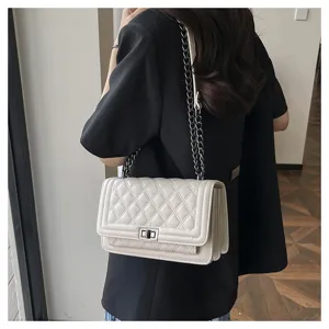 Elegant white quilted chain crossbody bag for women, stylish and chic fashion accessory.