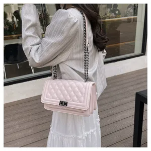 Stylish pink quilted chain shoulder bag for women, elegant faux leather crossbody bag.