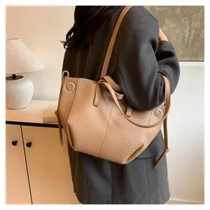 Detail view of a stylish beige women tote bag, featuring large capacity and versatile design.
