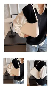 Minimalist retro baguette shoulder bag for women, stylish faux leather underarm handbag.