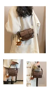 Chic brown woven leather crossbody shoulder handbag with stylish knot detail and fluffy charm.