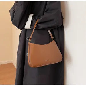 Stylish brown baguette shoulder bag for women, retro PU leather underarm handbag with strap.