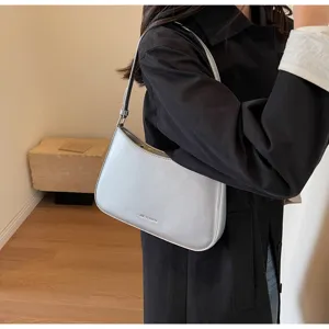 Silver metallic baguette shoulder bag for women, retro niche design underarm purse detail.