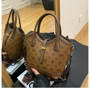 Vintage brown monogram bucket bag for women, large capacity shoulder and crossbody handbag.