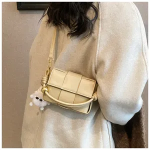 Beige woven leather shoulder bag crossbody handbag with plush charm for women winter