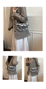 Detailed view of the stylish snake print crossbody chest bag worn by a model in a casual outfit.