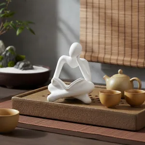 Resin thinker figurine statue detail view, modern minimalist home decor for desk and study.