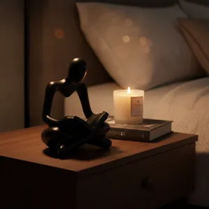 Exquisite resin thinker statue reading a book, modern black home decor for study desktop.