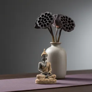 Detailed shot of Zen Buddha statue, miniature resin craft ornament for home entryway decor