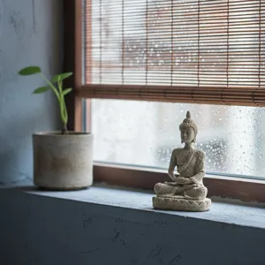 Mini Southeast Asian Buddha statue resin craft, zen home decor for living room entryway.