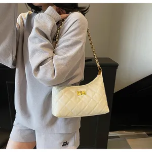 Close-up of the stylish quilted shoulder bag with chain strap and elegant turn-lock closure.