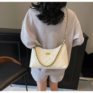 Detailed view of women white quilted shoulder bag with gold chain strap, stylish hobo design.