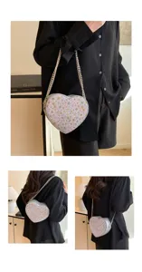 Chic floral heart-shaped chain shoulder bag, stylish crossbody bag for women's daily fashion wear.
