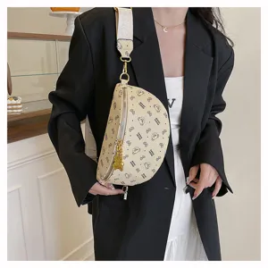 Stylish crescent chest bag for women, trendy beige crossbody waist bag with cute bear print.