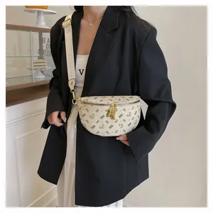 Detailed view of stylish cream fanny pack with cute bear print, sling bag and crossbody.
