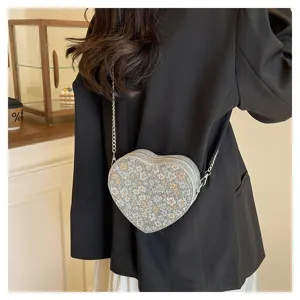 Chic heart-shaped floral chain shoulder bag, stylish crossbody bag for women daily fashion use.