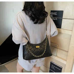 Black quilted leather shoulder bag for women with chic gold chain strap and turn-lock design.