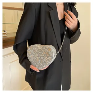 Chic floral heart-shaped crossbody bag with metal chain strap, fashionable women's shoulder bag