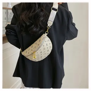 Detailed view of the stylish chest bag with bear print, wide patterned strap and chain.