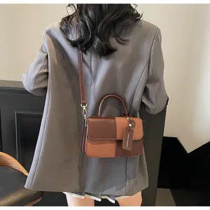 Detail view of the contrast color retro crossbody shoulder bag, stylish handle and chic design.