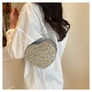 Chic floral heart chain bag, stylish new crossbody underarm bag for women daily wear.