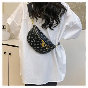 Detail view of stylish black chest bag with cute bear pattern, versatile crossbody design.
