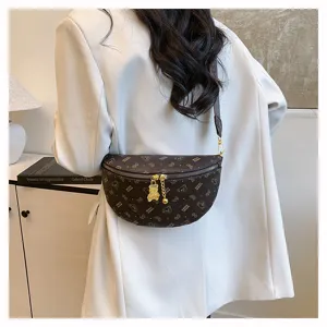 Stylish brown monogram chest bag with cute bear pendant for trendy daily streetwear.