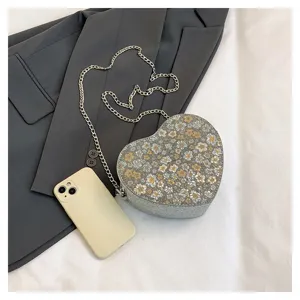 Chic heart-shaped floral chain shoulder bag for women, stylish crossbody underarm bag.