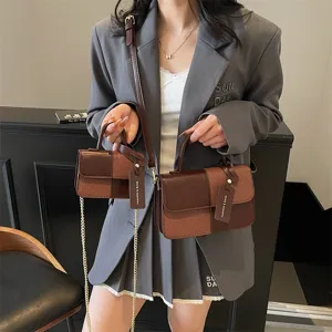 Retro color-block small handbag for women, chic PU leather shoulder and crossbody bag.