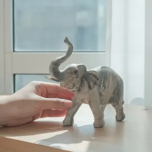 Resin elephant figurine home decor, lucky auspicious animal ornament for living room desk.