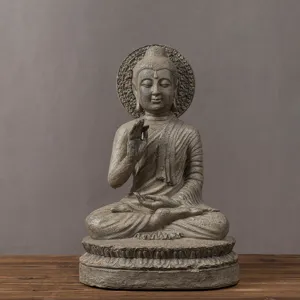 Detailed close-up view of resin Buddha statue zen sculpture ornament for home desk decor.