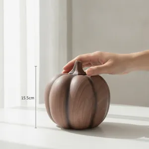Resin pumpkin ornament detail view, stylish wood grain texture table decor, height 15.5cm.