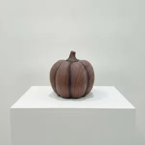 Resin pumpkin ornament with wood grain water transfer finish, elegant desktop decor detail view.