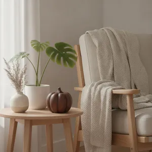 Detail shot of wooden pumpkin ornament on side table, cozy home decor and desktop accent.