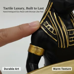 Close-up detail of Egyptian Anubis resin statue, hand-antiqued bronze texture finish.