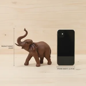 Resin elephant figurine detail view showcasing fine wood grain texture and size comparison.