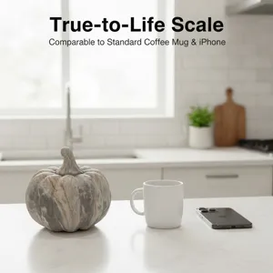 Detailed view of eco-friendly resin decorative pumpkin ornament on a clean kitchen counter.