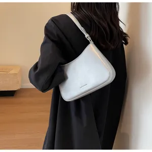 Silver baguette shoulder bag for women, retro chic underarm purse with adjustable strap.