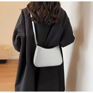 Stylish silver shoulder baguette bag for women, modern minimalist design handbag daily wear.