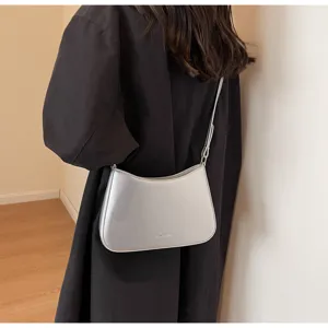 Chic silver baguette bag for women, stylish underarm shoulder bag and versatile crossbody purse.